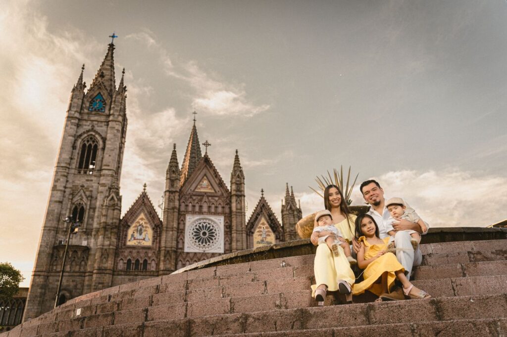 pexels photo 16949264 16949264 Happy family sitting on steps of the historic Basilica in Guadalajara, Mexico at sunset.